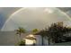 Waterfront home featuring beautiful views with a striking rainbow in the background at 2279 Mermaid Ne Pt, St Petersburg, FL 33703