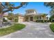 Beautiful home with lush landscaping, circular tower, and paver driveway at 2279 Mermaid Ne Pt, St Petersburg, FL 33703