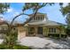 Charming home showcasing a circular driveway and lush landscaping for enhanced curb appeal at 2279 Mermaid Ne Pt, St Petersburg, FL 33703