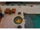 Hot tub view from above showcasing the patio steps and adjacent landscaping at 2279 Mermaid Ne Pt, St Petersburg, FL 33703