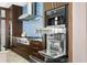 Gourmet kitchen featuring stainless steel Miele appliances, custom cabinetry, and ample counter space at 2279 Mermaid Ne Pt, St Petersburg, FL 33703