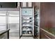 Kitchen storage features custom pull outs for glassware, dishware, and serving pieces at 2279 Mermaid Ne Pt, St Petersburg, FL 33703