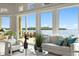 Bright living room features comfortable seating and stunning waterfront views at 2279 Mermaid Ne Pt, St Petersburg, FL 33703