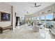 Open concept living area boasts water views, a modern kitchen, and stylish furnishings at 2279 Mermaid Ne Pt, St Petersburg, FL 33703