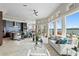 Open concept living area boasts water views, a modern kitchen, and stylish furnishings at 2279 Mermaid Ne Pt, St Petersburg, FL 33703