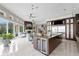 Open concept living space showcasing the kitchen island and living area with fireplace at 2279 Mermaid Ne Pt, St Petersburg, FL 33703