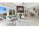 Comfortable living room boasts a modern fireplace, water views, and stylish furniture at 2279 Mermaid Ne Pt, St Petersburg, FL 33703