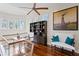 Charming loft with hardwood floors, book shelving, a ceiling fan, and ample natural light from numerous windows at 2279 Mermaid Ne Pt, St Petersburg, FL 33703