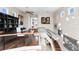 Spacious loft with hardwood floors, glass railing, and plenty of natural light from windows, creating an inviting atmosphere at 2279 Mermaid Ne Pt, St Petersburg, FL 33703
