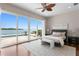 Stunning main bedroom with water views, large windows, and access to the pool and patio at 2279 Mermaid Ne Pt, St Petersburg, FL 33703
