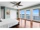 Bright main bedroom features private balcony overlooking bay waters and ceiling fan at 2279 Mermaid Ne Pt, St Petersburg, FL 33703
