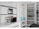 Organized pantry with white shelving, countertop appliances, and ample storage space for kitchen essentials at 2279 Mermaid Ne Pt, St Petersburg, FL 33703