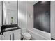 Contemporary bathroom featuring black hardware, decorative tile, and built in shelving at 2560 4Th S Ave, St Petersburg, FL 33712