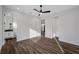 Modern bedroom featuring wood floors, neutral paint, a ceiling fan, and ensuite bathroom at 2560 4Th S Ave, St Petersburg, FL 33712
