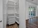 Organized closet with adjustable shelving and sliding basket drawers for maximum storage at 2560 4Th S Ave, St Petersburg, FL 33712