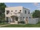 Contemporary two-story home with stucco exterior, a covered entry, and minimalist landscaping at 2560 4Th S Ave, St Petersburg, FL 33712