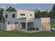 Modern home with an attached garage, minimalist design, and desert-style landscaping in the front at 2560 4Th S Ave, St Petersburg, FL 33712