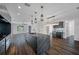Modern kitchen featuring a large black marble island, contemporary pendant lighting, and open layout at 2560 4Th S Ave, St Petersburg, FL 33712