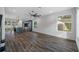 Spacious living area with dark hardwood floors, large windows, modern lighting, and open flow at 2560 4Th S Ave, St Petersburg, FL 33712
