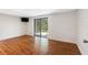 The basement has wood floors and a glass sliding door to the outside at 412 Manor Blvd, Palm Harbor, FL 34683