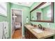 This is a bathroom with a double sink vanity and the doorway to another room at 412 Manor Blvd, Palm Harbor, FL 34683