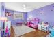 Colorful bedroom with hardwood floors, butterfly decals, and ceiling fan at 412 Manor Blvd, Palm Harbor, FL 34683