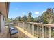 Inviting deck offering stunning views of the peaceful lake and mature landscaping at 412 Manor Blvd, Palm Harbor, FL 34683