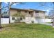 Beautiful home with a balcony, white picket fence, and well-maintained landscaping at 412 Manor Blvd, Palm Harbor, FL 34683