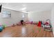 Spacious playroom features wood floors, two windows, and lots of toys at 412 Manor Blvd, Palm Harbor, FL 34683