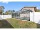 This backyard features a screened in pool with lots of privacy at 412 Manor Blvd, Palm Harbor, FL 34683