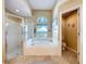 Bright bathroom featuring a separate shower and tub for relaxation at 4315 Whittner Dr, Land O Lakes, FL 34639