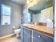 Bathroom with a window, shower, neutral walls and floors, and vanity with drawers at 4315 Whittner Dr, Land O Lakes, FL 34639