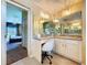 Bathroom vanity area features ample counter space, cabinet storage, and a makeup vanity area with a chair at 4315 Whittner Dr, Land O Lakes, FL 34639