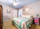 Bedroom with a bed with a quilt, carpet, fan, closet, and gray-blue ceiling at 4315 Whittner Dr, Land O Lakes, FL 34639