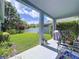 This covered patio is perfect for outdoor entertaining with a view of the lush backyard at 4315 Whittner Dr, Land O Lakes, FL 34639