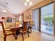 Dining area with tile floors and sliding glass doors to the outdoor patio at 4315 Whittner Dr, Land O Lakes, FL 34639