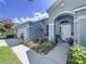 The front of the home features a well-maintained lawn and beautiful landscaping at 4315 Whittner Dr, Land O Lakes, FL 34639
