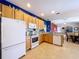 Well-lit kitchen with modern appliances and ample cabinet space for storage at 4315 Whittner Dr, Land O Lakes, FL 34639