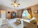 Bright living room featuring carpeted floors and a large window at 4315 Whittner Dr, Land O Lakes, FL 34639