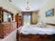 Comfortable bedroom showcasing a cozy bed, dresser, and serene natural light at 4315 Whittner Dr, Land O Lakes, FL 34639