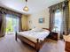 Cozy bedroom with bed, decor, and a sliding door to the outside at 4315 Whittner Dr, Land O Lakes, FL 34639