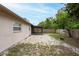The home's backyard is ready to be personalized and features a screened in patio and space for a fire pit at 4323 S Lois Ave, Tampa, FL 33611