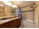Bathroom with double vanity, tub and shower with modern fixtures at 4323 S Lois Ave, Tampa, FL 33611