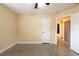 Cozy bedroom featuring neutral walls and a ceiling fan at 4323 S Lois Ave, Tampa, FL 33611