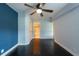 Bedroom featuring ceiling fan, closet and ensuite bathroom at 4323 S Lois Ave, Tampa, FL 33611