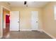Bedroom featuring carpeted floors, two closets and neutral paint at 4323 S Lois Ave, Tampa, FL 33611
