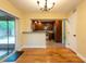 View of kitchen from light-filled dining area with sliding doors at 4323 S Lois Ave, Tampa, FL 33611