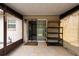 Cozy screened patio with tile flooring and outdoor storage at 4323 S Lois Ave, Tampa, FL 33611