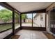 Screened patio with tile flooring offering backyard access at 4323 S Lois Ave, Tampa, FL 33611