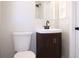 Modern bathroom featuring a vanity with a dark wood cabinet and matte black fixtures at 4572 33Rd N Ave, St Petersburg, FL 33713